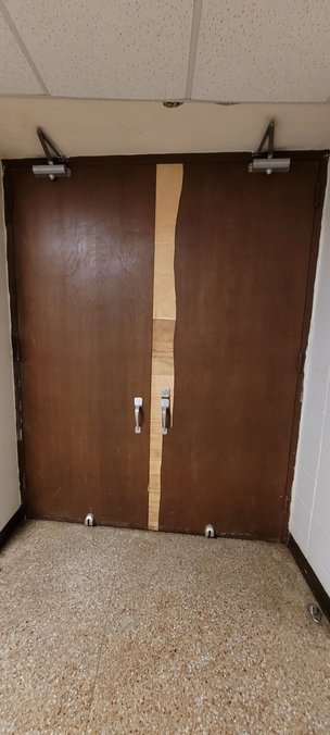 Many of the doors at Royal Junior High have peeling facades and do not have Americans with Disabilities Act-compliant door handles. Staff are replacing items where they can, but the current maintenance and operations budget does not supply enough funding to complete all of the repairs and upgrades needed.